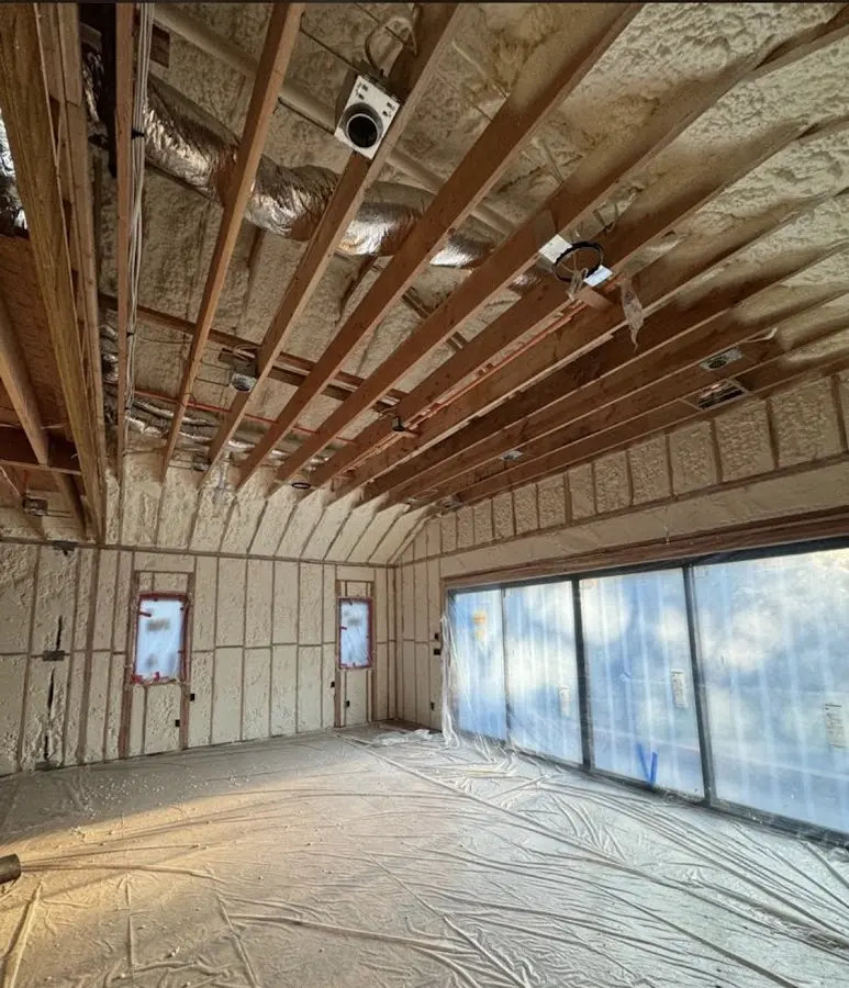 Interior walls and ceiling insulated with spray foam during new construction in Toledo